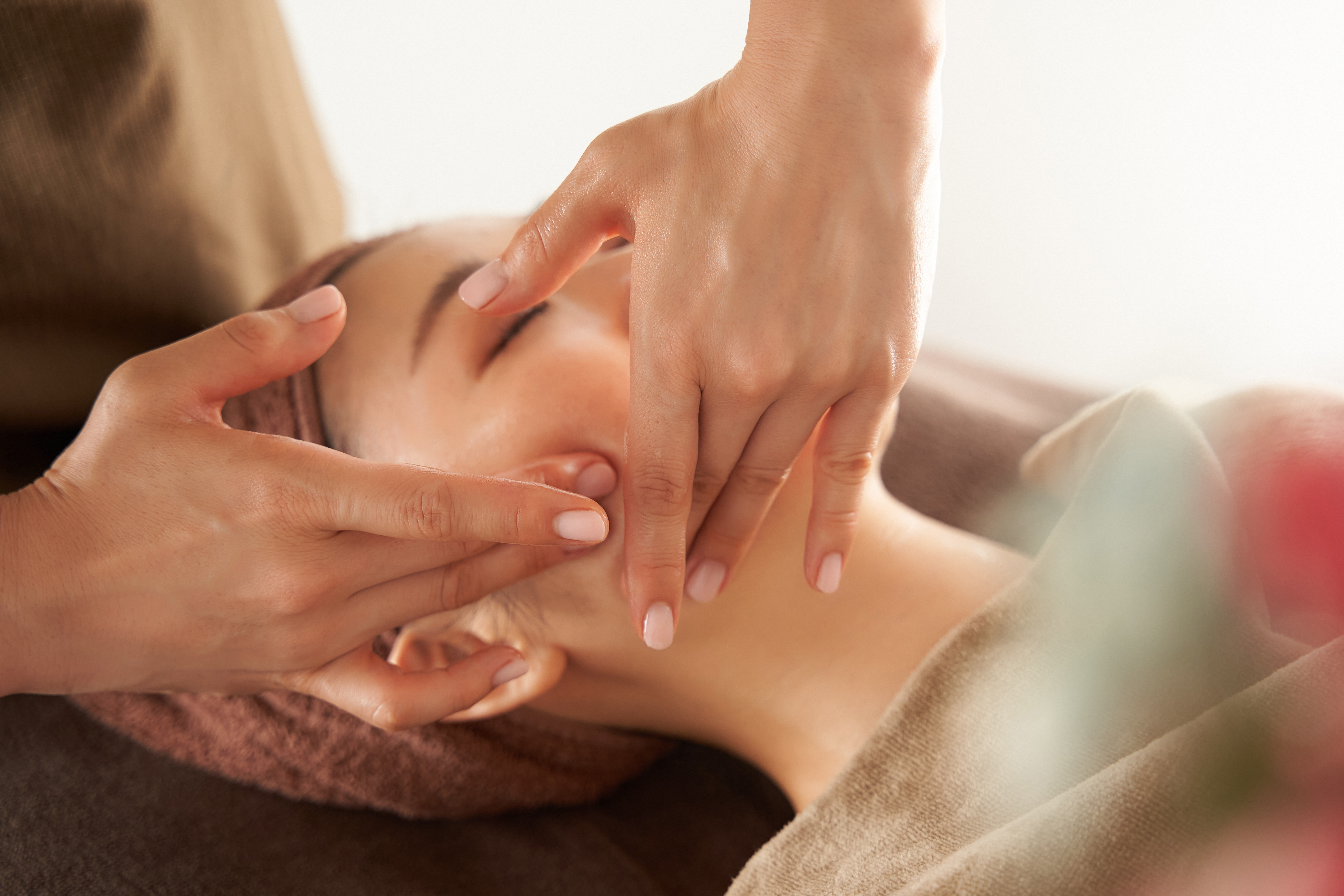 Esthetician doing facial on client