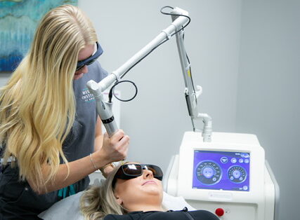 Woman working on laser treatment